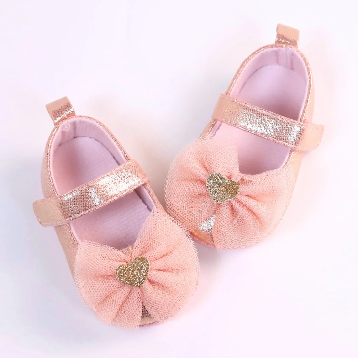 Breathable toddler girl shoes with elegant lace overlay and a charming butterfly knot, perfect for comfort.