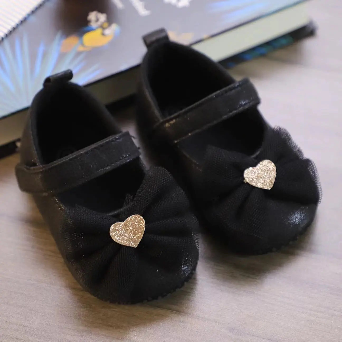Pink lace and butterfly knot toddler shoes, designed for baby girls' comfort and fashion.