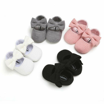 Adorable pink princess bow first walker shoes for girls, soft sole & anti-slip for infants.
