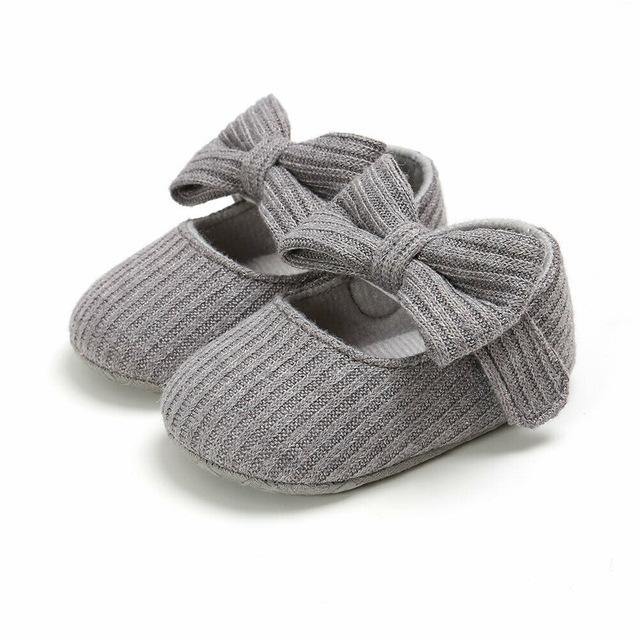 Baby fashion: Girls' first walker shoes in pink with adorable bow and soft, safe sole.