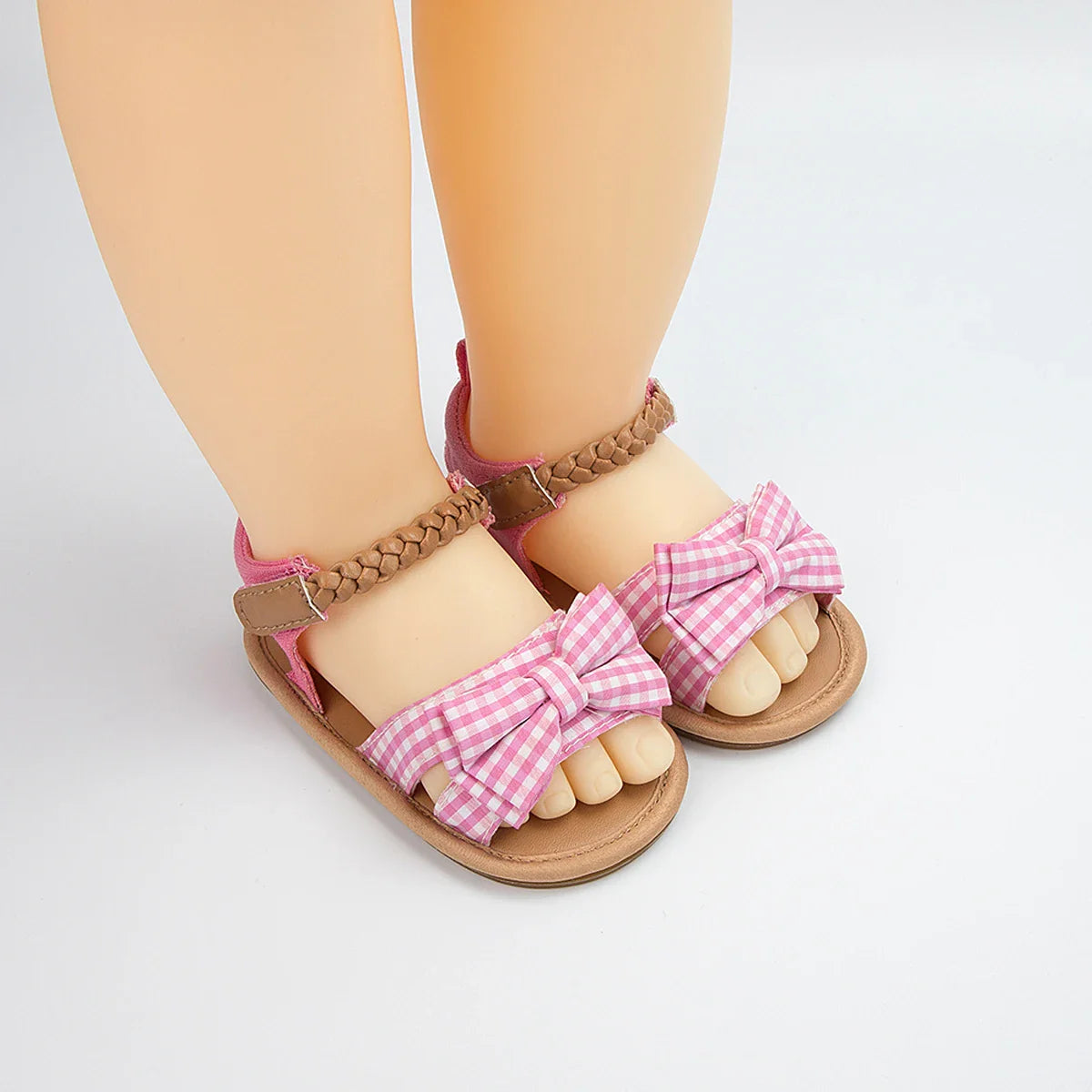Comfortable pink bow sandals for toddlers, a must-have in baby girl shoes collection.