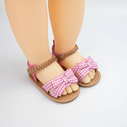 Comfortable pink bow sandals for toddlers, a must-have in baby girl shoes collection.