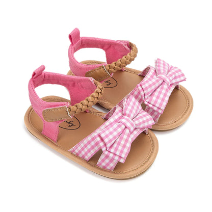 Charming pink princess bow sandals, a great addition to baby accessories.
