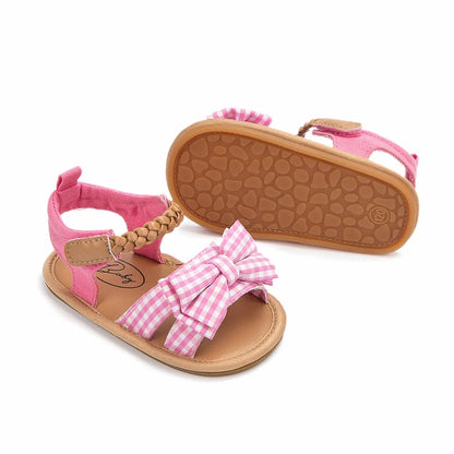 High-quality pink baby girl shoes, princess bow sandals made from soft cotton.