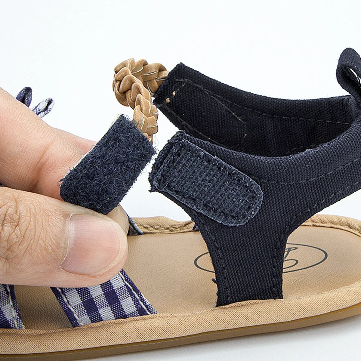 Soft cotton fabric baby girl sandals with a decorative princess bow, anti-slip design.