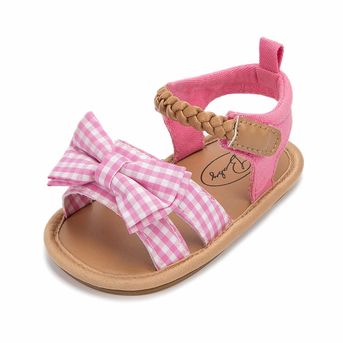 Little girl's pink sandals with a lovely bow, perfect for infant footwear.