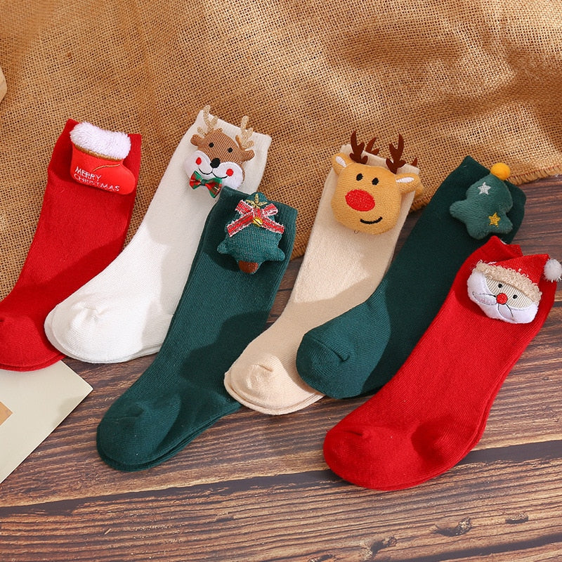 Detail of the comfortable elastic cuff on 3D animal non-slip baby socks for girls.