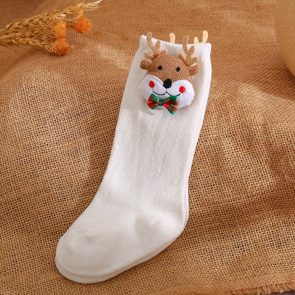 Little girl's feet wearing pink rabbit 3D animal non-slip baby socks, great for crawling.