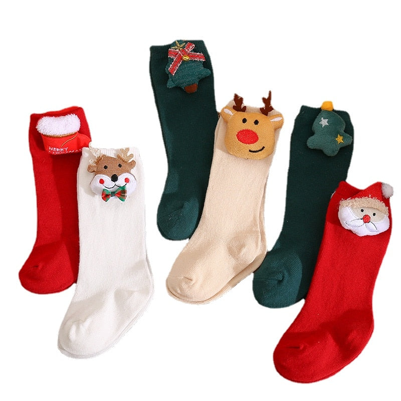 Pile of vibrant 3D animal non-slip baby socks for girls, essential toddler clothing.