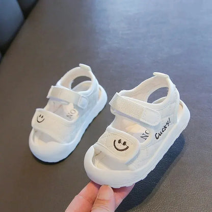 White baby soft sole summer sandals with easy closure, great foot protection for active toddlers.