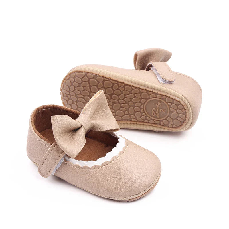 Prewalker shoes for baby girls, bowknot design, anti-slip safety features.