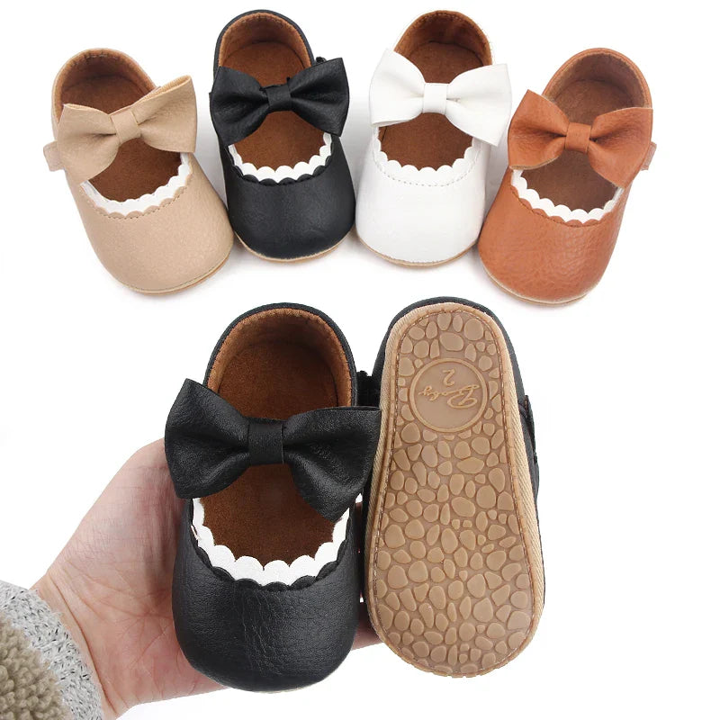 Cute infant soft sole bowknot shoes, perfect for first walking stages.
