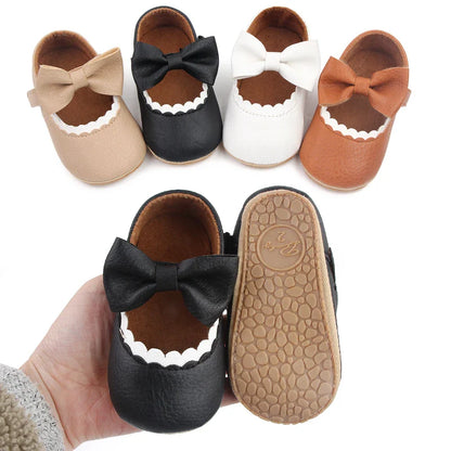 Cute infant soft sole bowknot shoes, perfect for first walking stages.