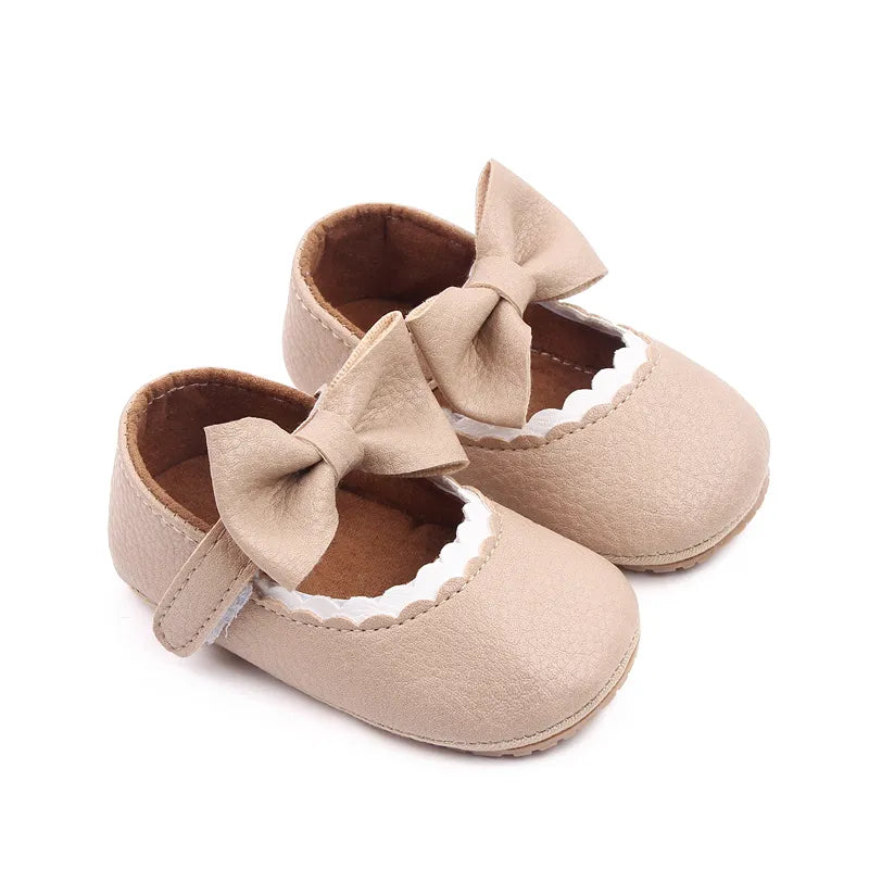 Newborn soft sole bowknot shoes, anti-slip, providing gentle support.