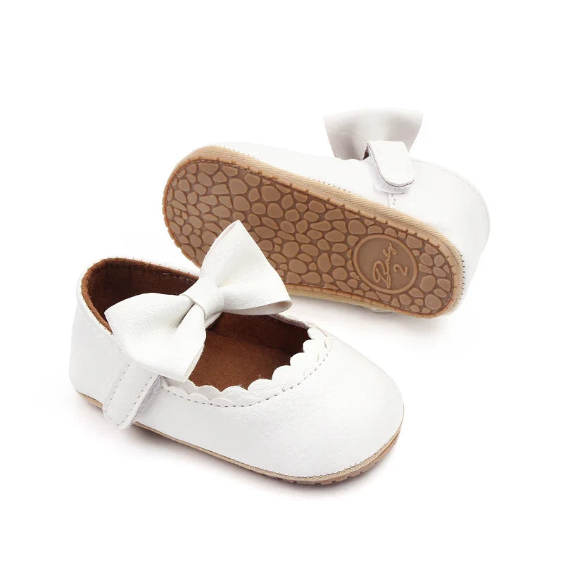 Pink toddler bowknot anti-slip shoes, ideal for baby's developing feet.