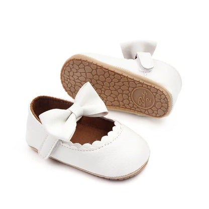 Pink toddler bowknot anti-slip shoes, ideal for baby's developing feet.