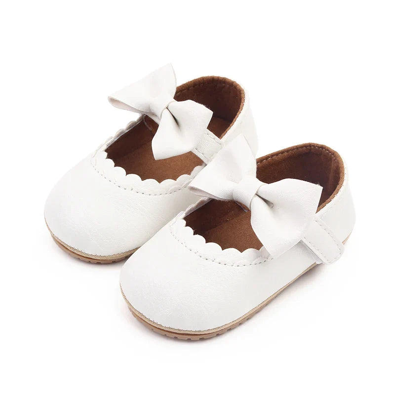 Baby first walking shoes, anti-slip with a pretty bowknot detail.