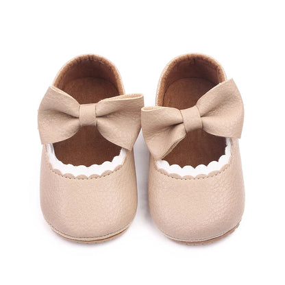 Newborn baby prewalker shoes with a charming bowknot design, anti-slip sole.