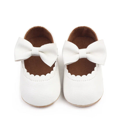 Toddler girl's anti-slip soft sole shoes featuring a sweet bowknot.