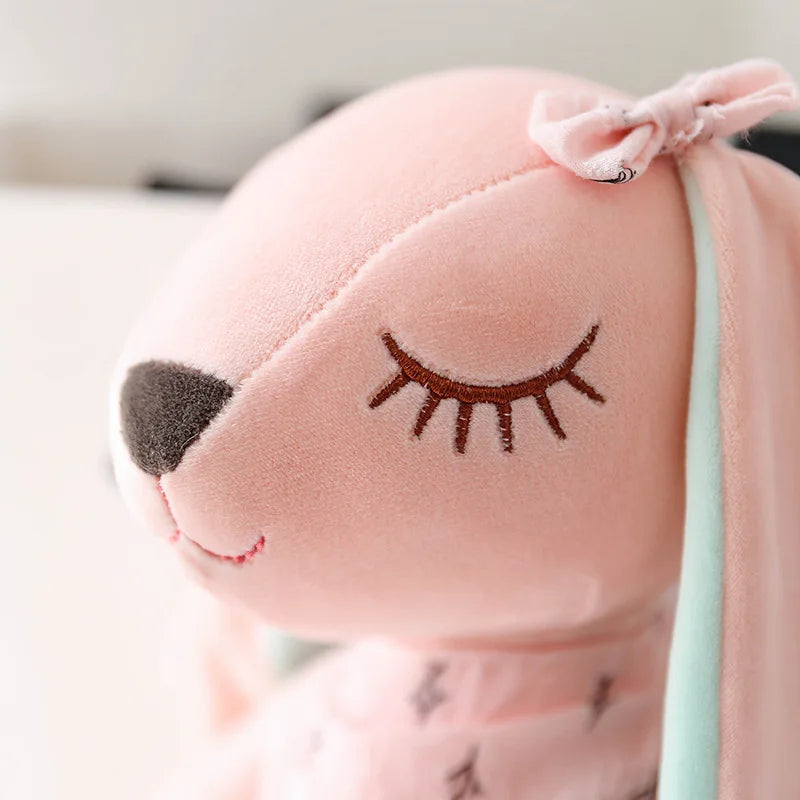Unisex plush rabbit stuffed animal, a cute and soft comfort toy for kids playtime and nursery decor.