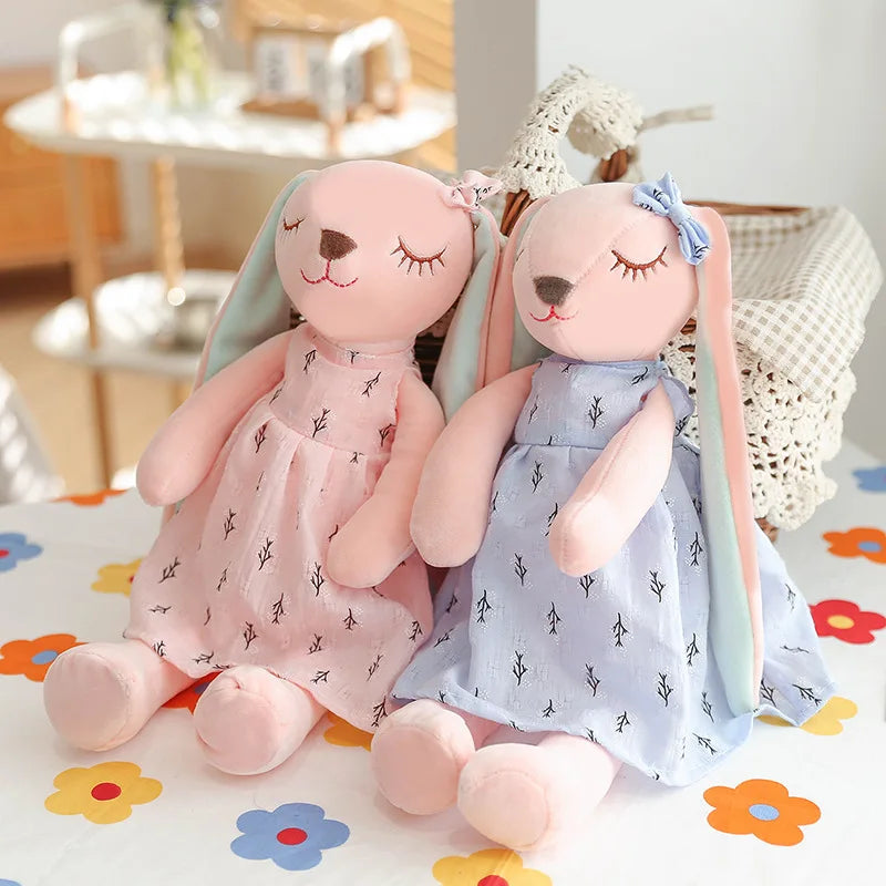 Soft stuffed animal rabbit in a playful pose, a delightful addition to any nursery or child's room.