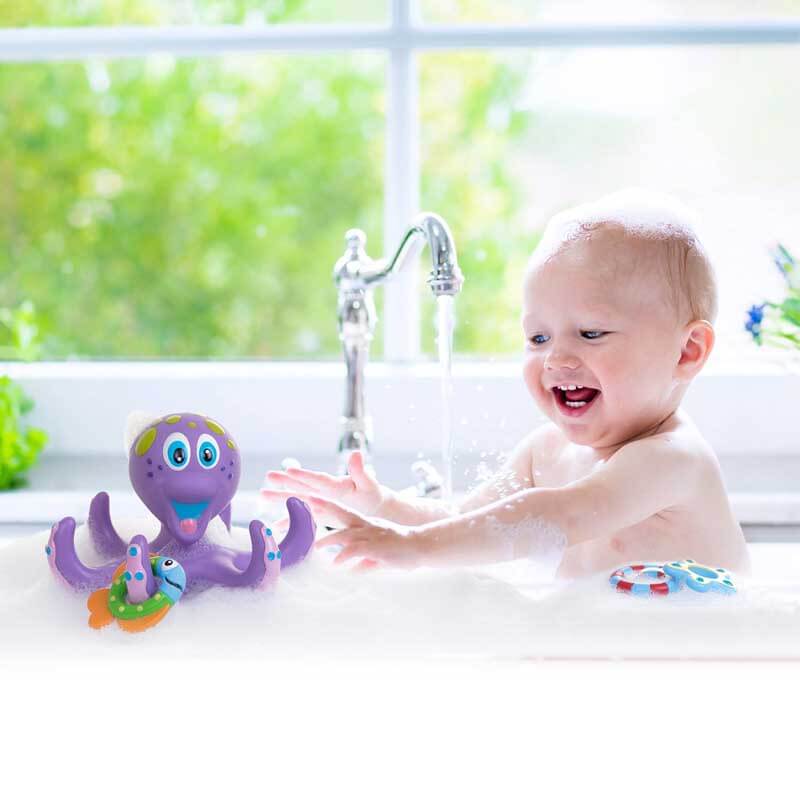 Toddler enjoying octopus bath ring toss game, developmental kids water play toy