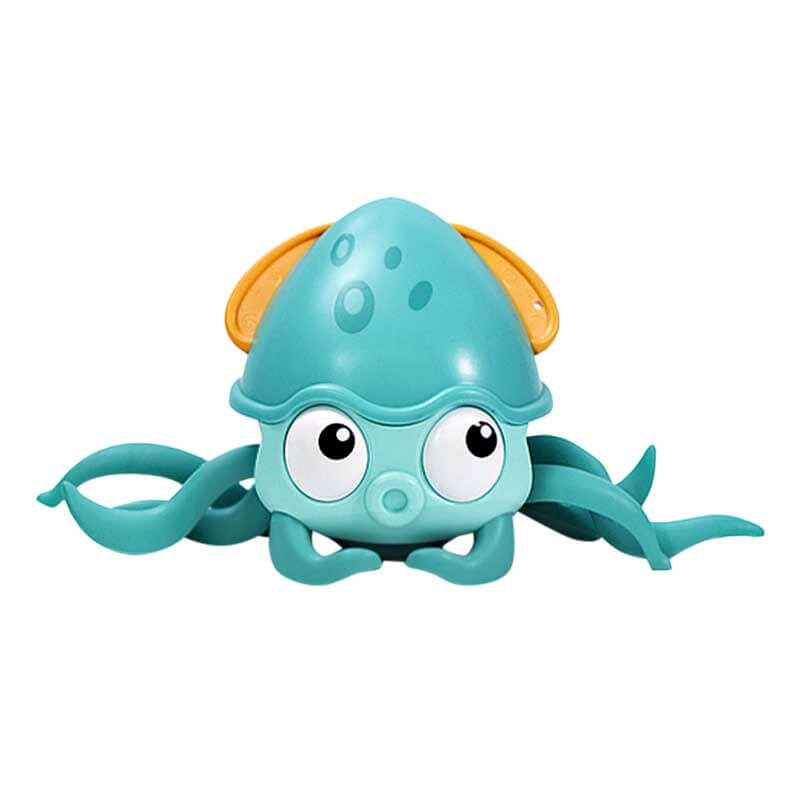 Smiling child playing with wind-up octopus water toy