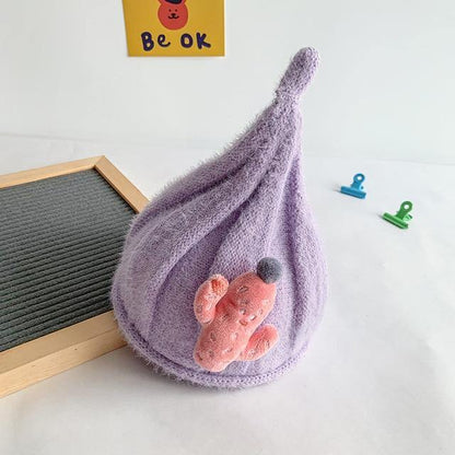 Overhead shot of a knit gnome hat for baby, showcasing the soft cotton wool material.