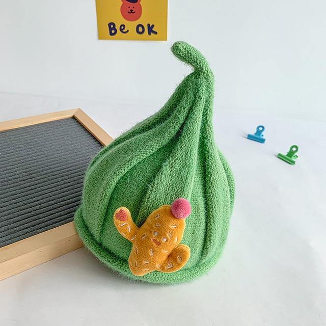 Front view of a baby's knit gnome beanie, designed for comfort and charming style.