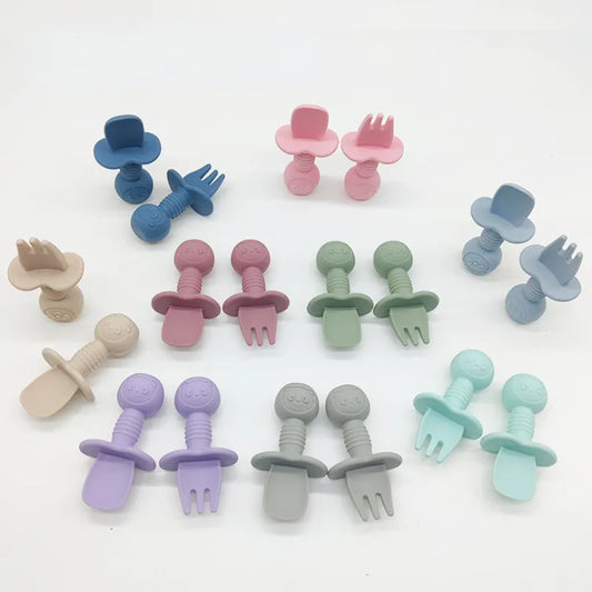 Adorable silicone bear baby fork and spoon set in soft blue, perfect for toddler self-feeding