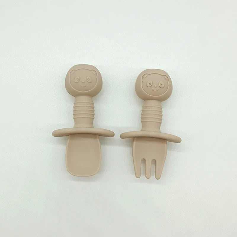 Vibrant orange silicone bear baby spoon, an essential for baby-led weaning and toddler eating