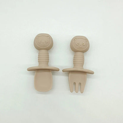 Vibrant orange silicone bear baby spoon, an essential for baby-led weaning and toddler eating