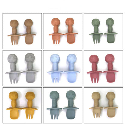 Collection of silicone bear baby feeding utensils, including fork and spoon, for nursing and feeding