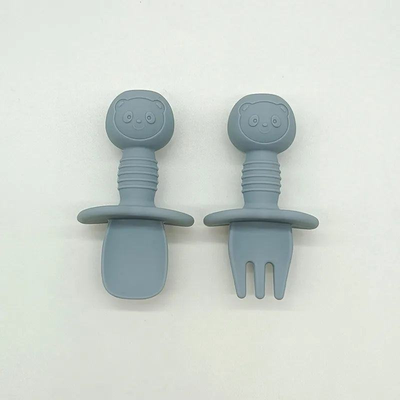 Soft green silicone bear baby spoon, gentle on gums and designed for infant feeding