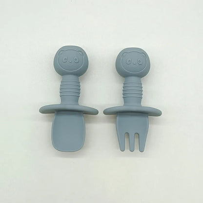 Soft green silicone bear baby spoon, gentle on gums and designed for infant feeding