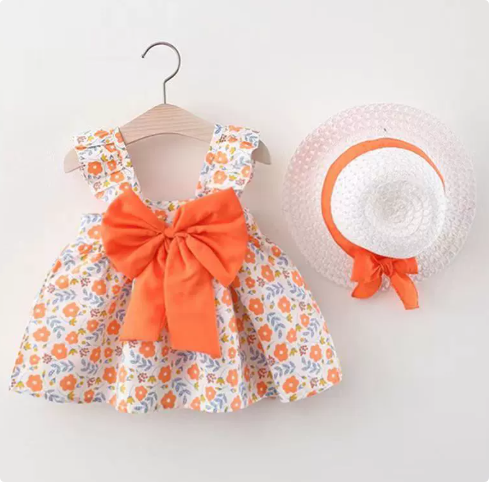 Soft cotton girls' summer dress featuring colorful fruit patterns, accessorized with a natural straw hat