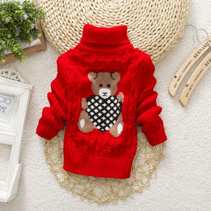 Closeup of soft knit kids' teddy bear turtleneck sweater, ideal for cozy children's fashion.