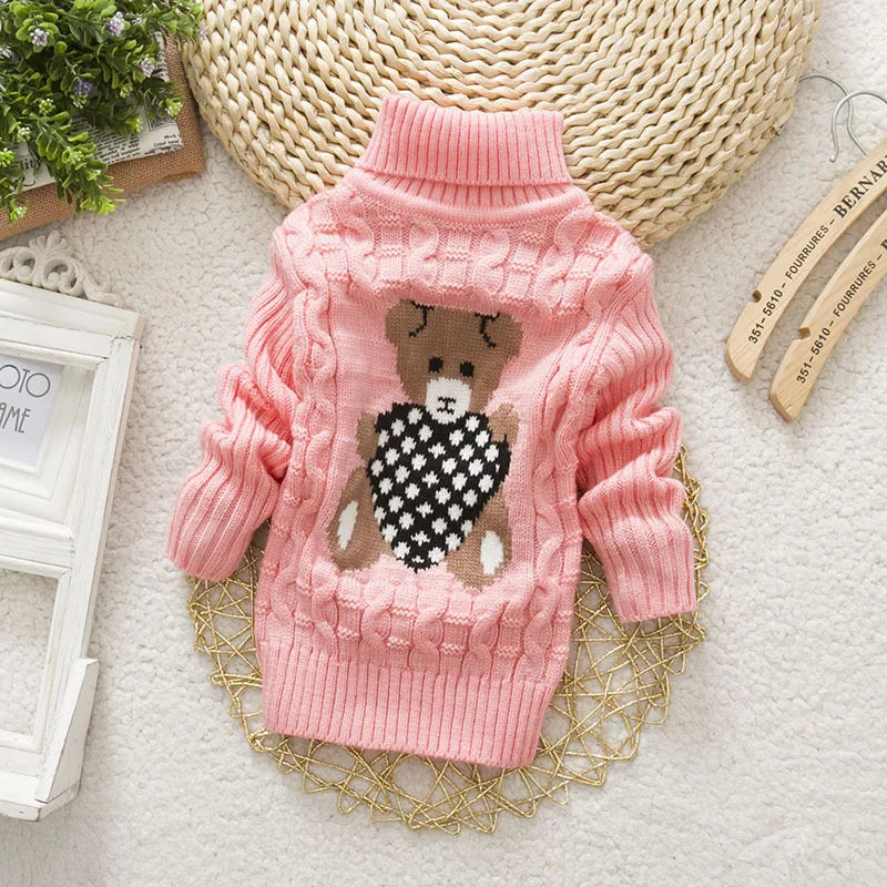 Plush teddy bear knit turtleneck sweater for toddlers, a cozy choice in winter apparel.