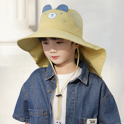 Baby playing in sand while wearing a white wide-brim sun hat, ensuring UV protection during outdoor play
