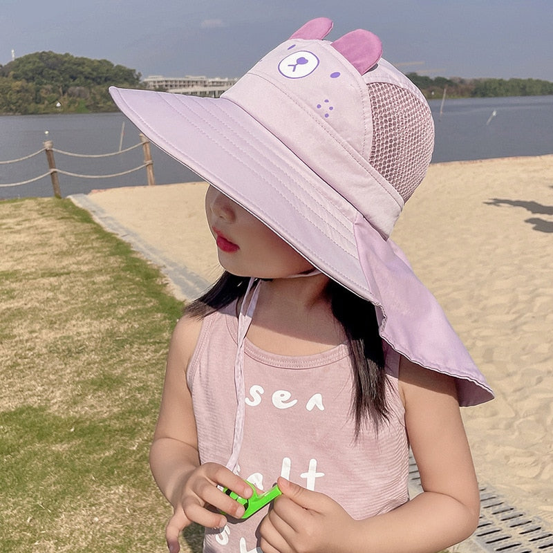 Kids' sun hat with a wide brim and adjustable strap, providing crucial UV protection for beach or park