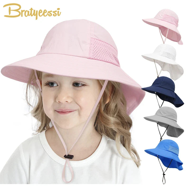 Close-up of a pink kids' adjustable sun protection bucket hat, showcasing the soft fabric and chin strap.