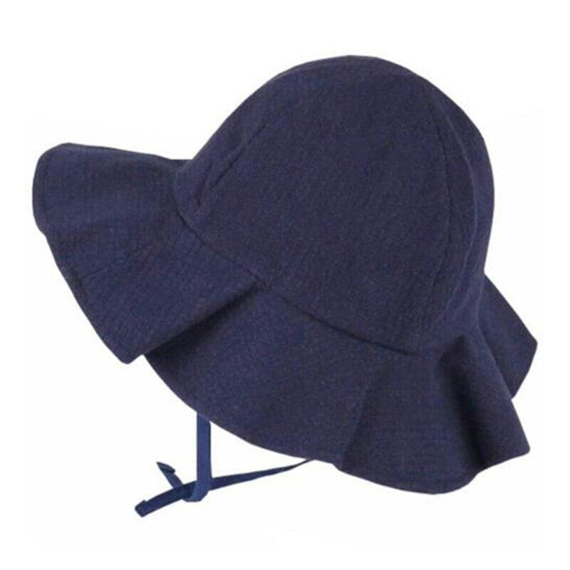 Yellow children's sun hat made of soft cotton, shown with adjustable strap, ideal for outdoor adventures.