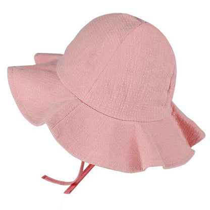Side view of a child's adjustable cotton sun hat in white, protecting face and neck from summer sun.
