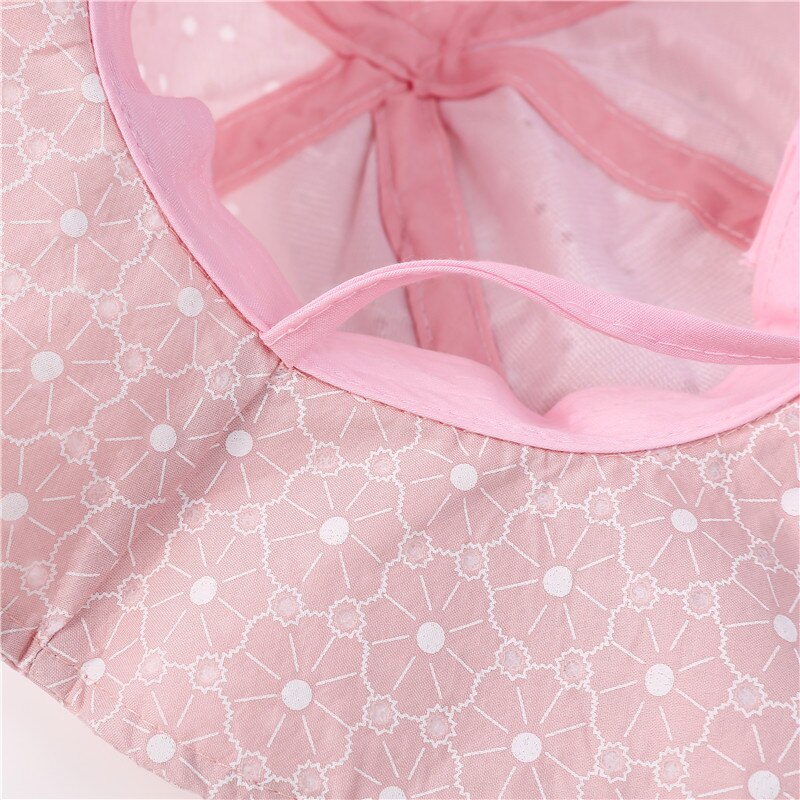 Detail of adjustable chin strap on a blue kids' cotton sun hat, ensuring a snug fit for beach days.