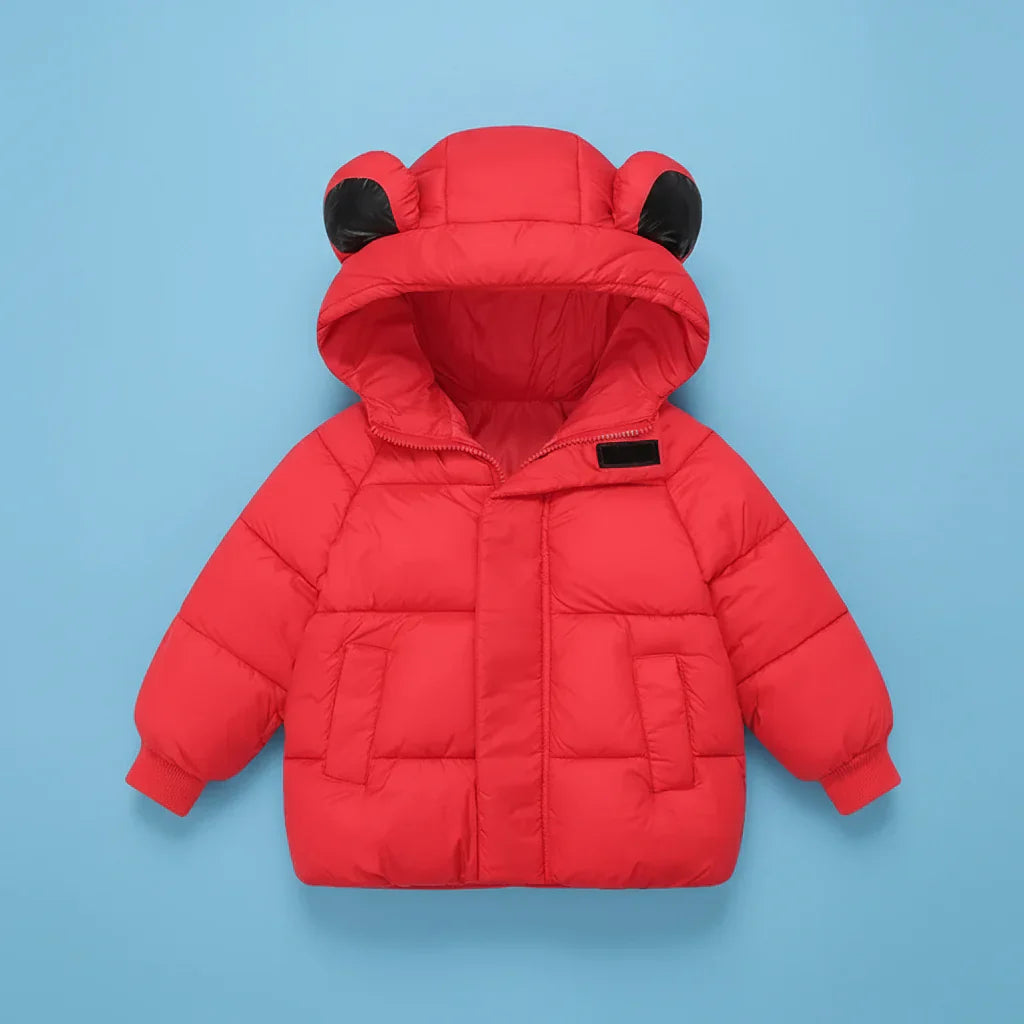 Child smiling in a comfortable hooded winter jacket with bunny ears, perfect for play.