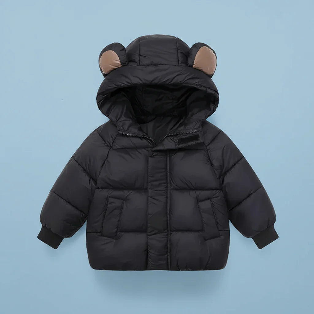 Texture shot of the fabric of the toddler winter coat, showing its warm, padded quality.