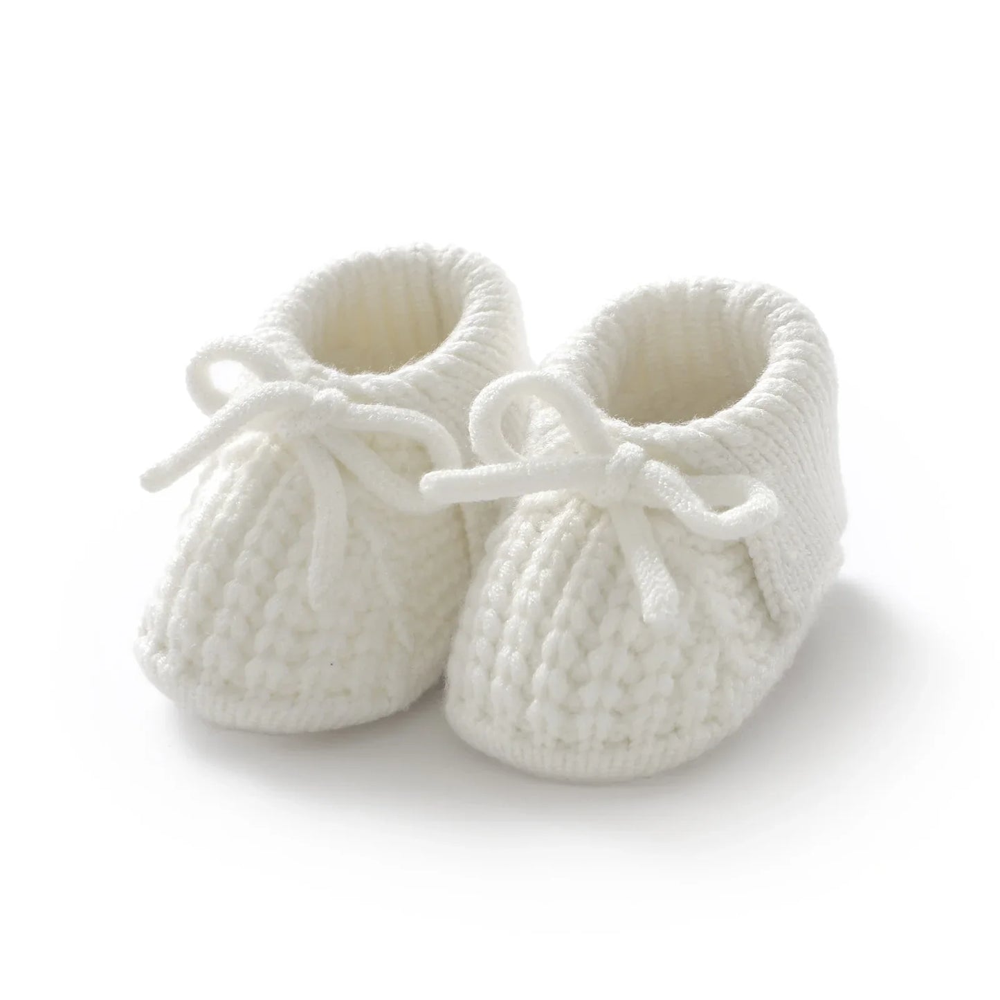 Beige knitted baby booties with a simple design, versatile unisex baby footwear, soft crib shoes