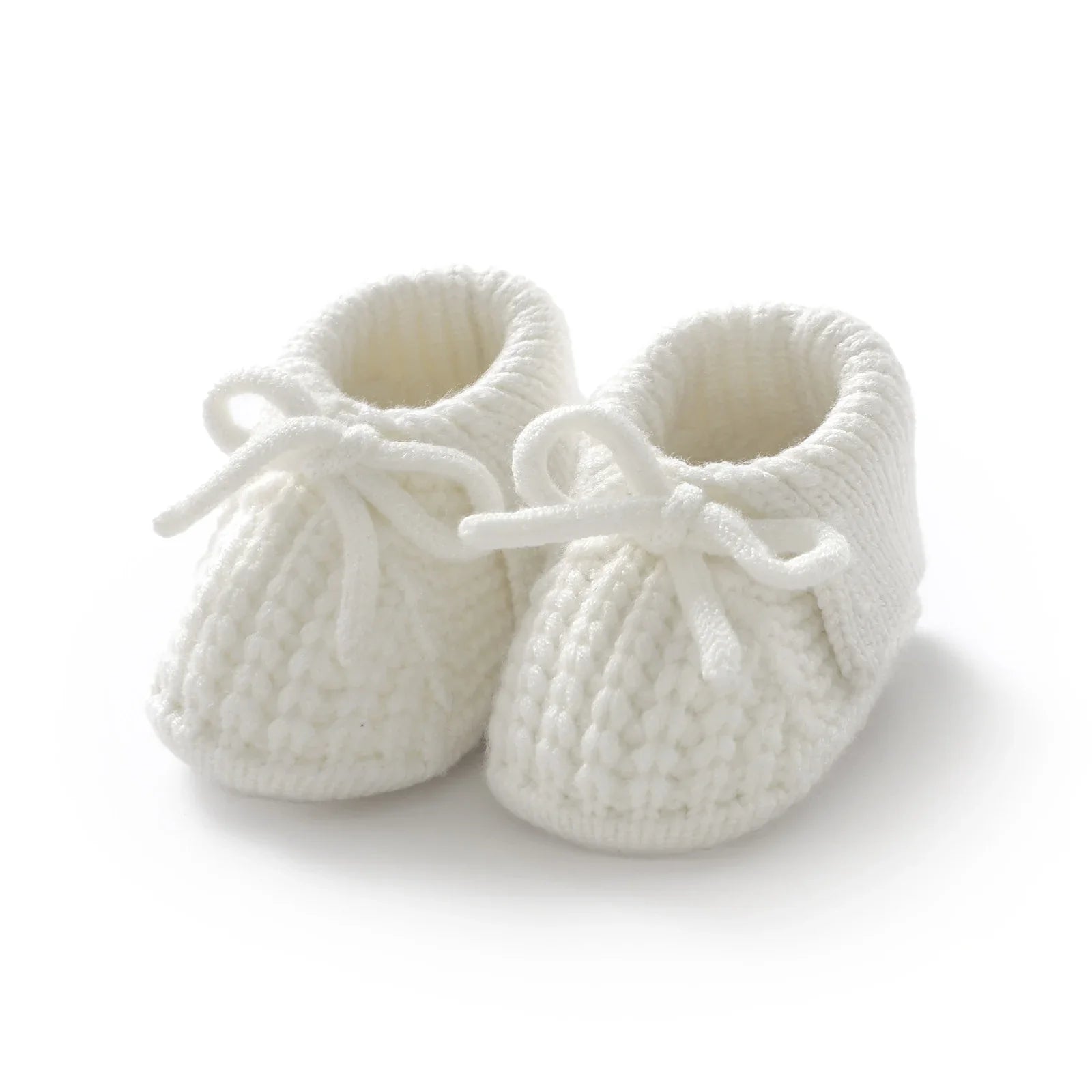 Beige knitted baby booties with a simple design, versatile unisex baby footwear, soft crib shoes