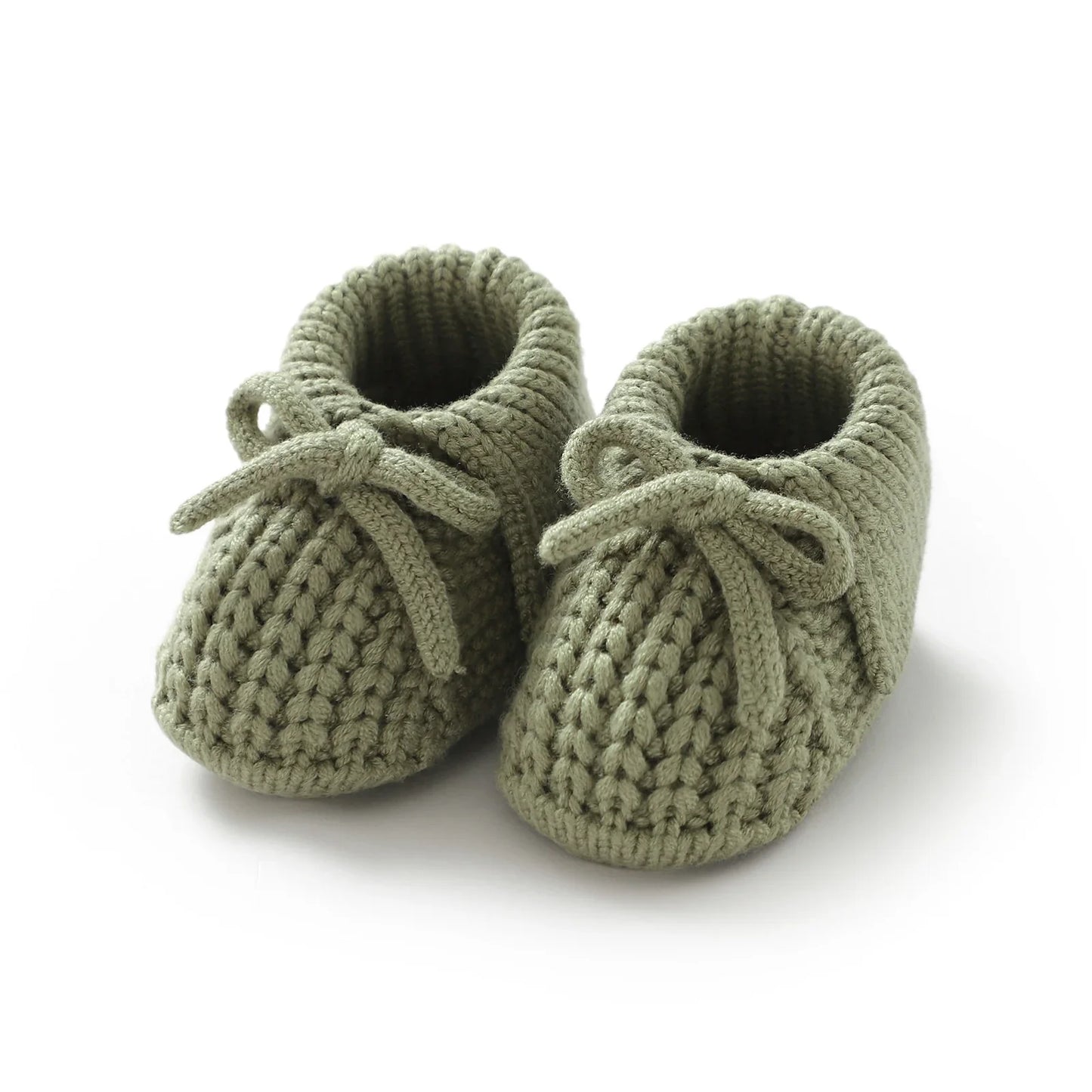 Handmade knitted baby booties, showcasing intricate knit pattern, warm infant footwear for cold weather