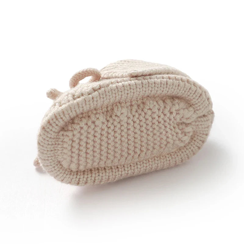 Pair of pink knitted baby booties, cozy handmade infant footwear, perfect newborn shoes 0-18 months